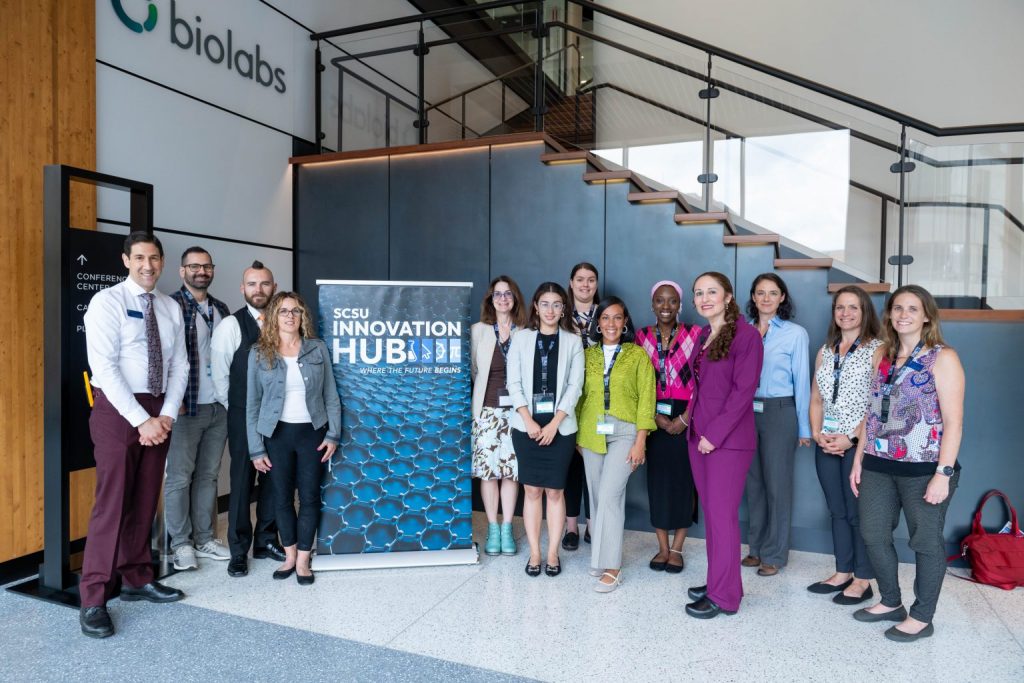 People in front of a banner reading SCSU INNOVATION HUB